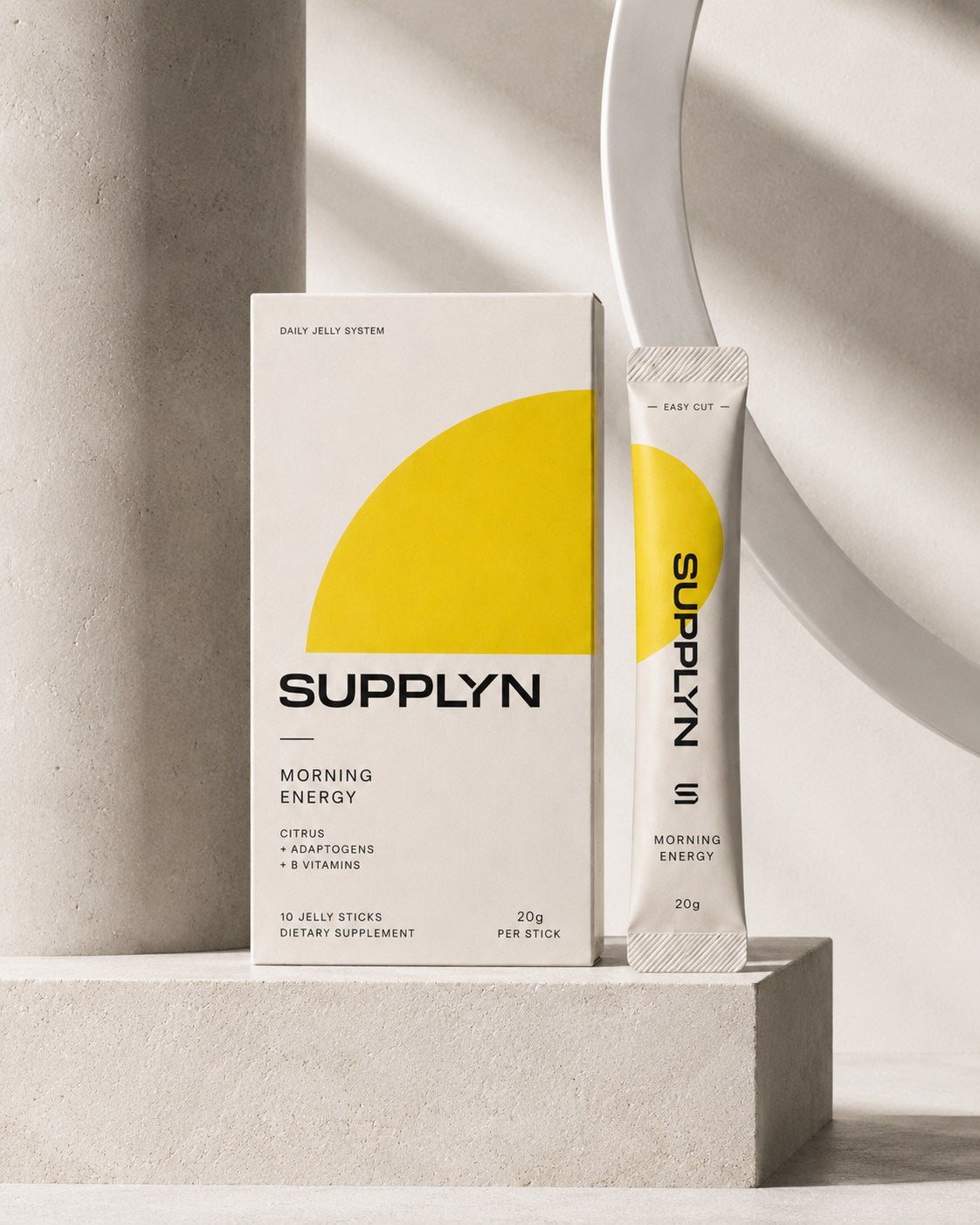 Supplyn Morning Energy box and jelly stick on a stone plinth